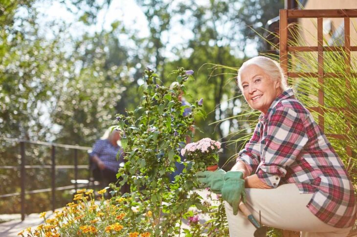 Senior Woman Taking Care of Her Plants in the Garden
